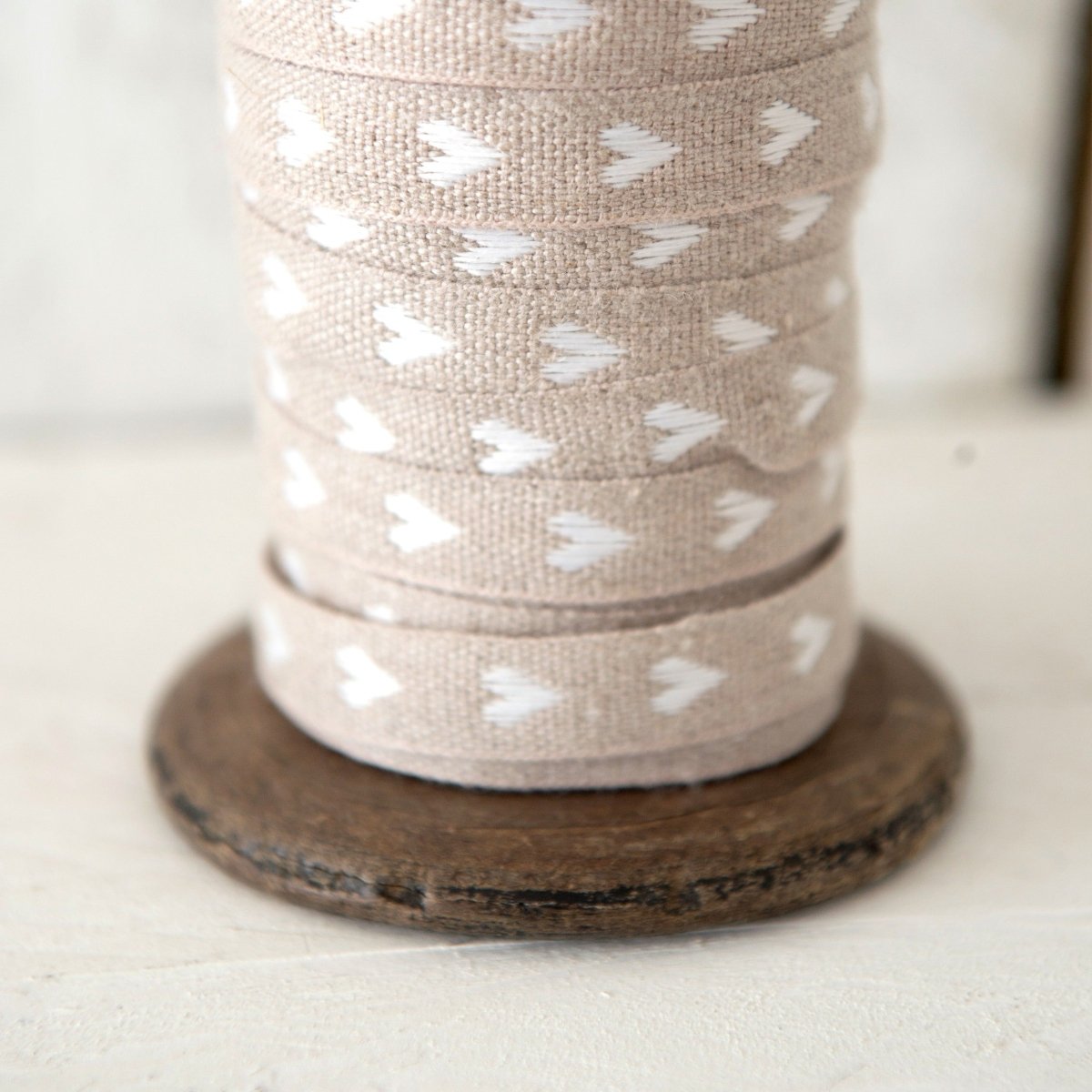 helen round haberdashery linen ribbon with white hearts on natural linen