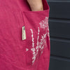 red linen apron pocket printed with flowers