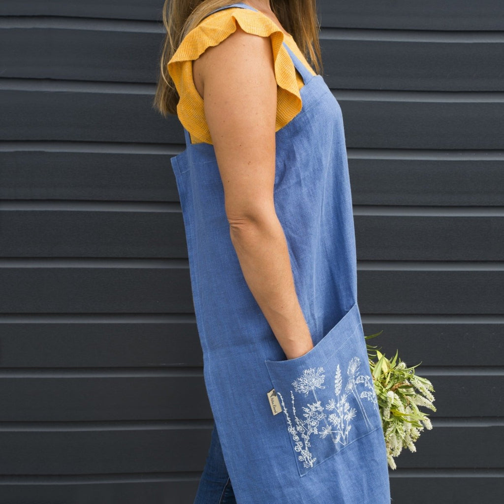 long blue linen apron printed pocket flowers